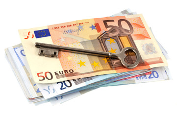 Billets de banque et clé maison