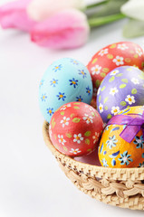 Easter eggs, basket, flowers