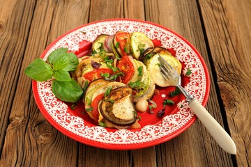Tasty vegetarian ratatouille made of eggplants, squash, tomatoes