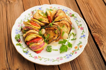 Tasty vegetarian ratatouille made of eggplants, squash, tomatoes