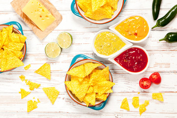 Plate of nachos with different dips