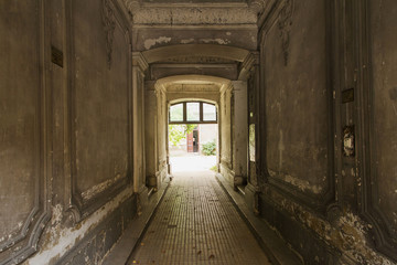 Decayed corridor in an abandoned residential building