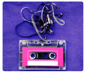 Audio cassette tape with subtracted out tape over blue textured
