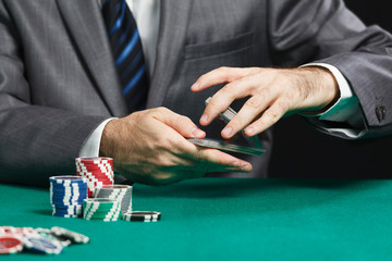 Blackjack Or Poker Game, Casino Worker Shuffling Cards