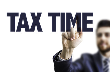 Business man pointing the text: Tax Time
