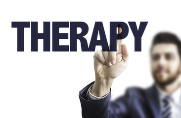 Business man pointing the text: Therapy