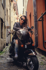 Casual girl on moto scooter.