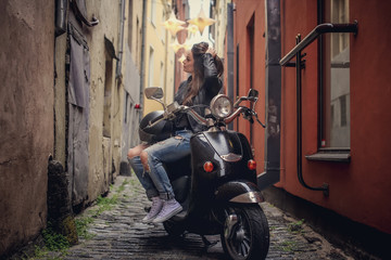Obraz na płótnie Canvas Casual girl on moto scooter.