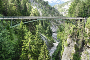 Fototapeta na wymiar Mountain landscape with bridge. Switzerland 