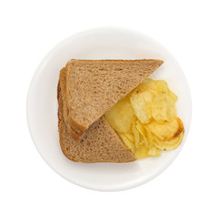 Whole wheat sandwich with chips on plate