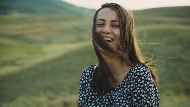 Smiling Woman Showing a Peace Sign