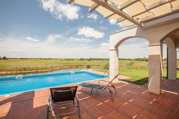 swimming pool outside luxury home and beautiful view