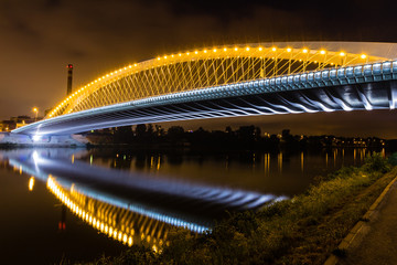 Fototapeta na wymiar Night view of the Troja Bridge from the river Vltava, Trojsky most, Prague, Czech republic