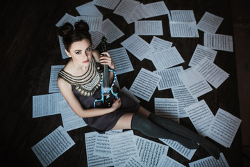 girl posing and holding a violin