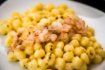 Gnocchi dish with cheese and fish