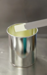 Yellow paint in a can