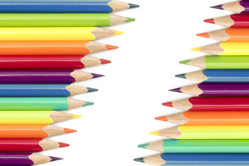 colored pencils  in two diagonal rows isolated on a white backgr