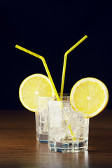 Two glasses of drink with ice