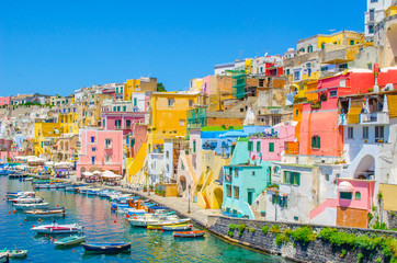 italian island procida is famous for its colorful marina, tiny narrow streets and many beaches which all together attract every year crowds of tourists coming from naples - napoli. - obrazy, fototapety, plakaty