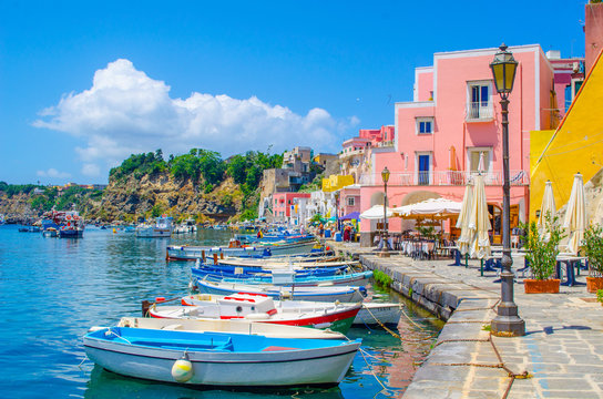 Fototapeta italian island procida is famous for its colorful marina, tiny narrow streets and many beaches which all together attract every year crowds of tourists coming from naples - napoli.
