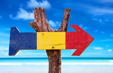 Romania Flag wooden sign with beach background