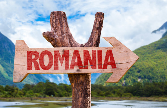 Romania Wooden Sign With Mountains Background