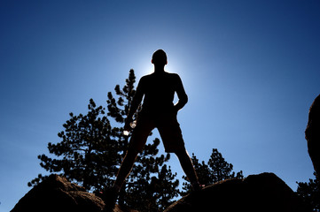 Man standing on the top of the hill