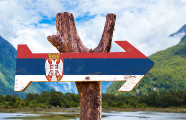 Serbia Flag wooden sign with mountains background