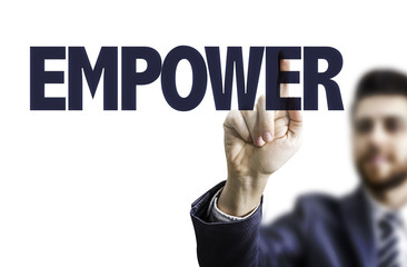 Business man pointing the text: Empower