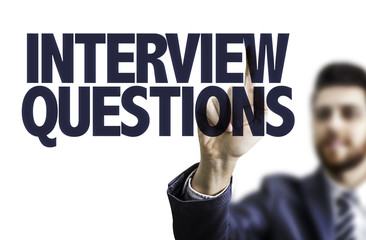 Business man pointing the text: Interview Questions