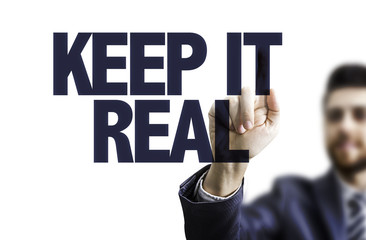 Business man pointing the text: Keep It Real
