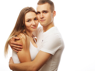Fototapeta premium lovely happy couple hugging over white background.