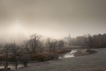 Obraz na płótnie Canvas Community church on a foggy morning.