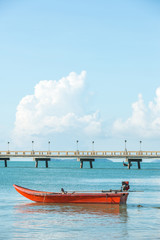 Red boat and blue ocean