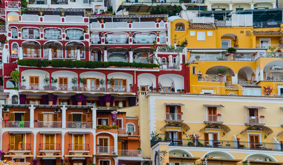 view of italian city positano situated on amalfi coast during summer sunset