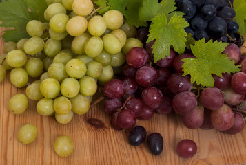 green grape,red grape,black grape with leaves
