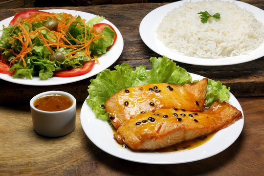 Salmon fillet with rice and salad