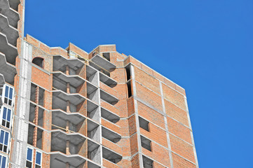 Building construction site work against blue sky