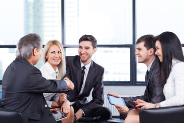 A group of businessmen discussing the policy of the company in t