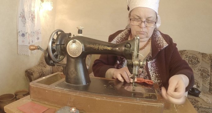grandmother sews a red flag on an old sewing machine of the Soviet Union retro
RAW format for color correction
See the entire collection - many super close-ups