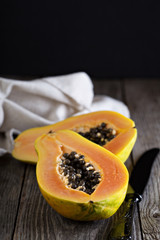 Cut papaya on a wooden table