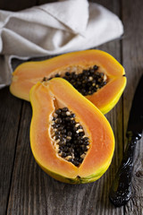 Cut papaya on a wooden table