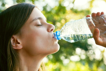 Woman drinking water - 89324884