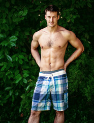 Young handsome man at the garden