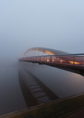 Bernatka footbridge over Vistula river in Krakow in heavy fog