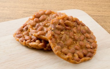 Close up Thai Snack Peanut Cracker on Cutting Board