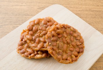Delicious Thai Snack Peanut Cracker on Wooden Board