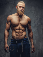 Muscular man with beard showing his great body.