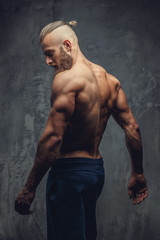 Fototapeta na wymiar Muscular guy from back