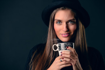 Woman drinking hot coffee